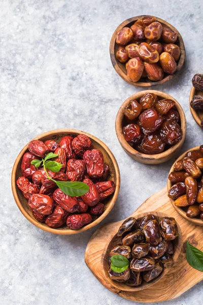 Top view of sweet dried dates (fruits of date palm Phoenix dactylifera). Bright saturated color and good texture.