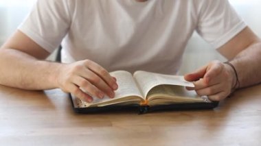 Sunday readings bible, a christian man reading the bible.