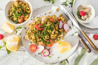 Scrambled Tofu crispy Toast , tomato salad. Vegan vegetarian, plant based food