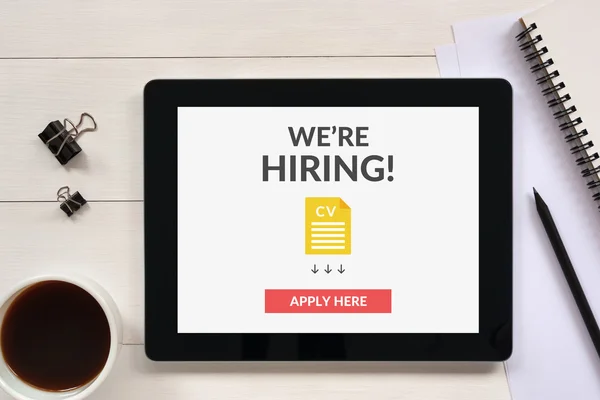 We are hiring apply now concept on tablet screen with office obj — Stock Photo, Image