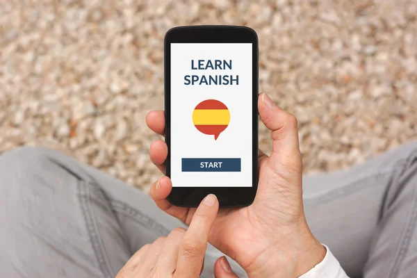 Teléfono inteligente con línea aprender concepto español en la pantalla —  Fotos de Stock
