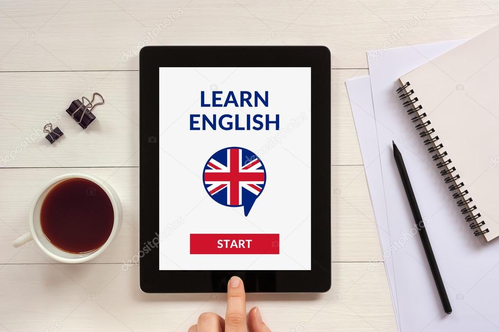 Online learn English concept on tablet screen with office object