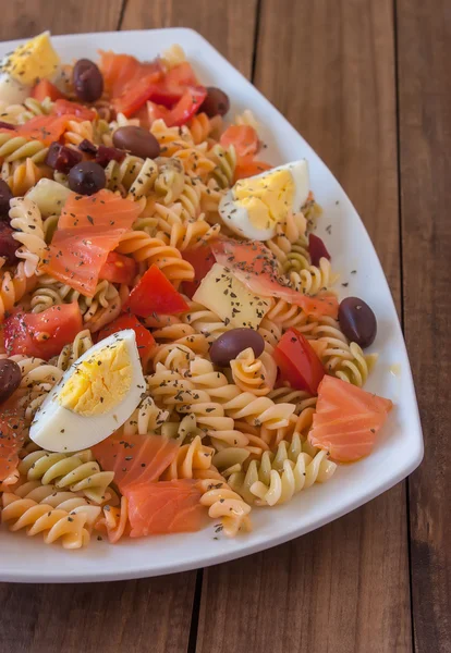 Pasta salad on wooden table