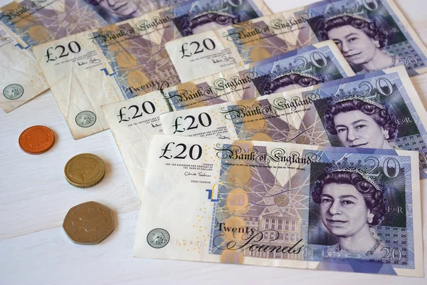 British sterling pound (GBP) notes with various coins — Stock Photo, Image