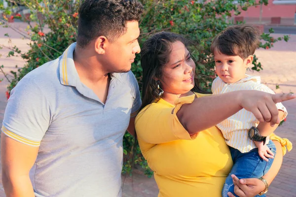 Portrait of Latin American family outdoors