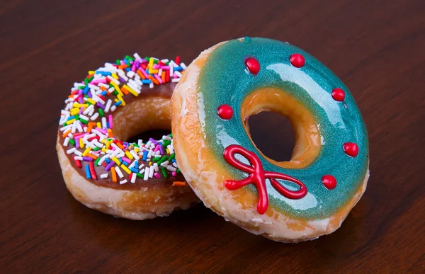 Donuts on wooden background — Stock Photo, Image