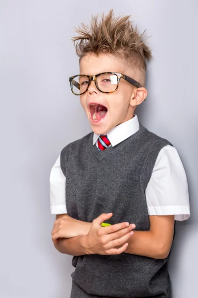 Funny schoolboy yawning — Stock Photo, Image