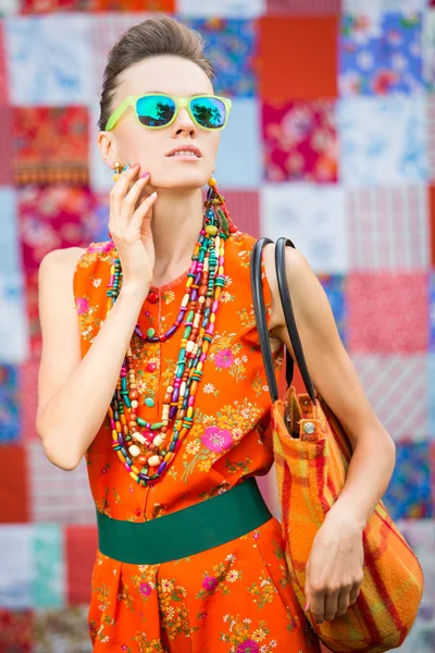 Stylish woman wearing sunglasses and accessories — Stock Photo, Image