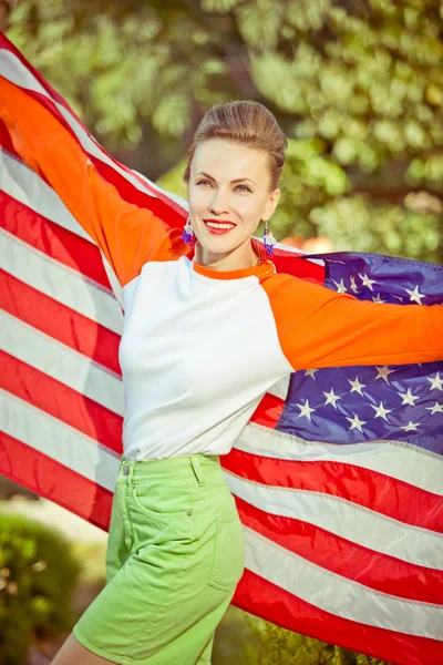 Beautiful woman with national usa flag — Stock Photo, Image