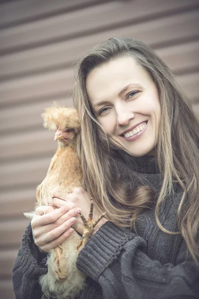 Woman with hen — Stock Photo, Image