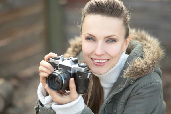 Girl with vintage retro camera — Stock Photo, Image