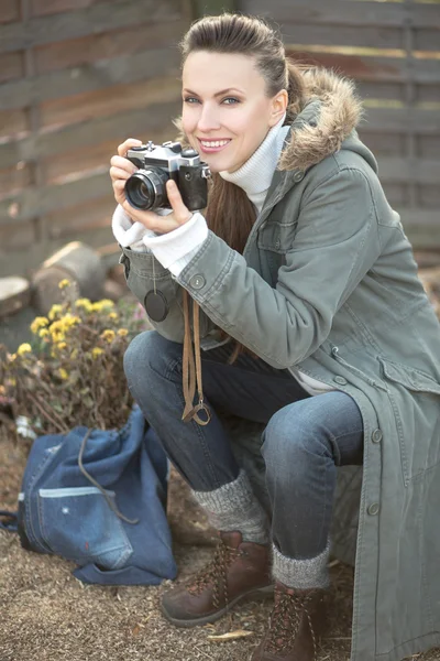 Girl with vintage retro camera — Stock Photo, Image