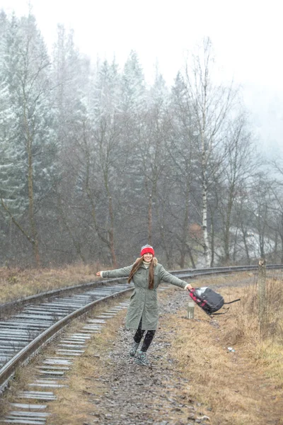 Tourist on railway in late autumn — Stock Photo, Image