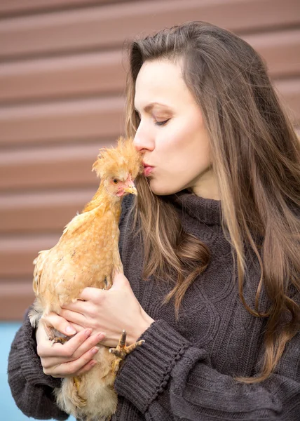Woman with hen — Stock Photo, Image
