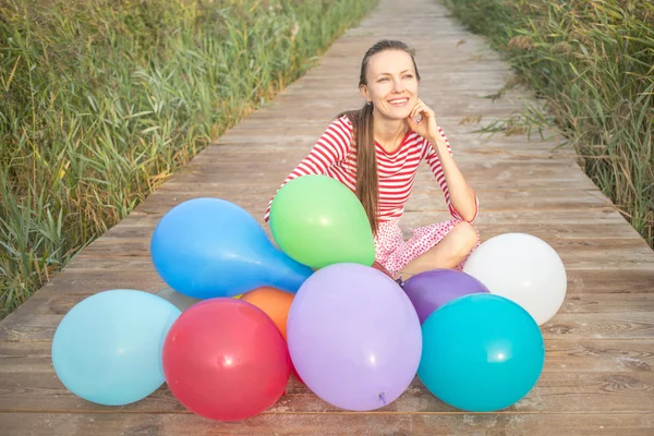 Woman with balloons — Stock Photo, Image