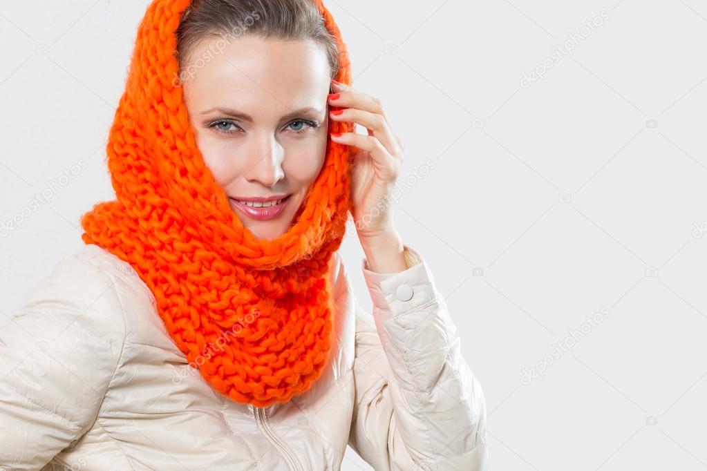 Beautiful woman in autumn color scarf