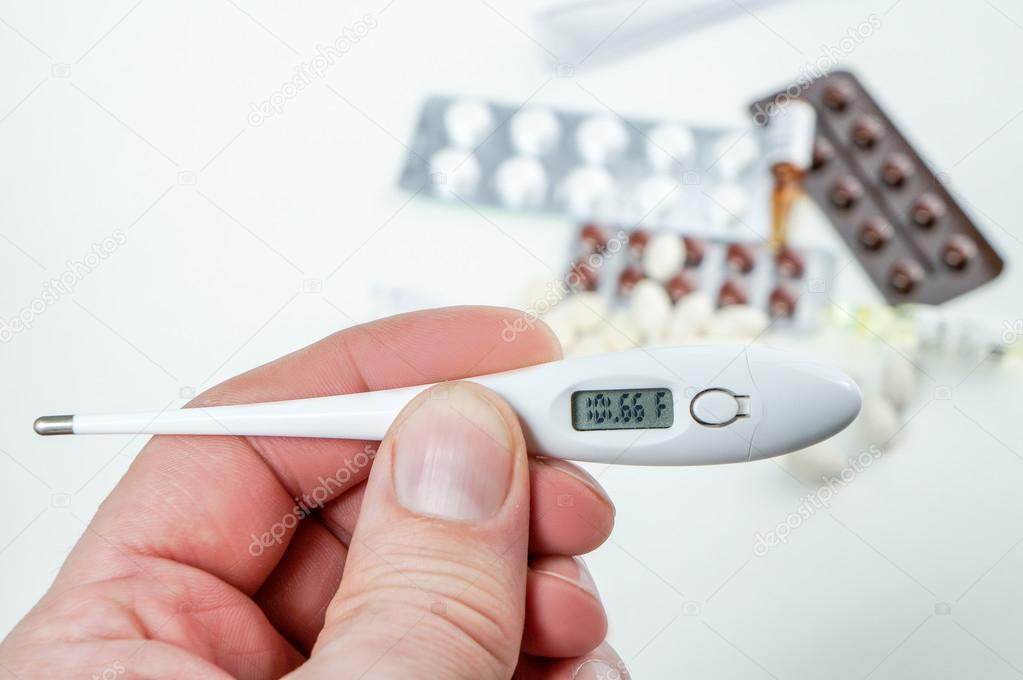 wallpapers Picture Of Thermometer Reading 101 https depositphotos com 97990002 stock photo man measure temperature holds thermometer html