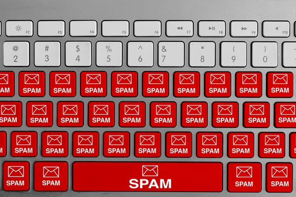 Computer keyboard with red spam email email buttons