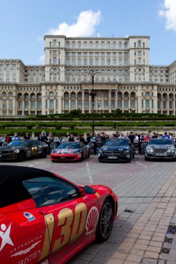 Bucharest, Romania, May 7, 2016: Super cars of the exclusive Gumboil 3000 parked in front of the Romanian Parliament. Gumball is an international celebrity rally which takes place on public roads.