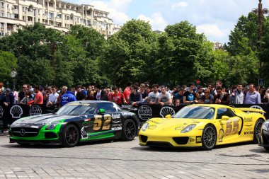 Bucharest, Romania, May 7, 2016: Super cars of the exclusive Gumboil 3000 parked in front of the Romanian Parliament. Gumball is an international celebrity rally which takes place on public roads.
