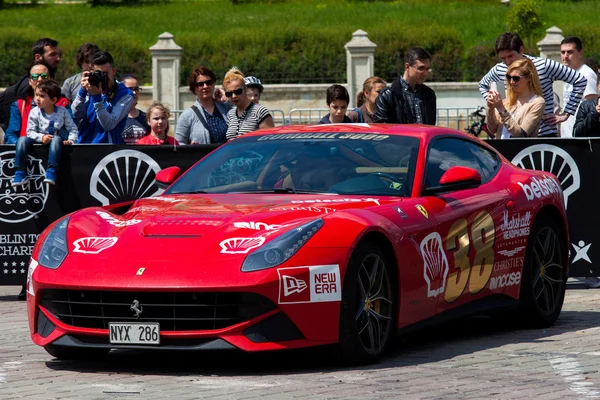 Bucharest, Romania, May 7, 2016: Super cars of the exclusive Gumboil 3000 parked in front of the Romanian Parliament. Gumball is an international celebrity rally which takes place on public roads.