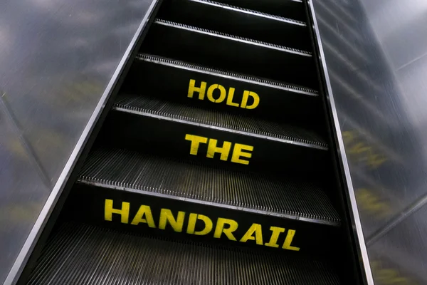 Escalator Yellow Hold Handrail Warning Sign — Zdjęcie stockowe