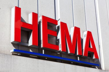 Amsterdam, The Netherlands - August 23, 2016: Hema sign. Hema is a Dutch discount retail chain that started life as a dimestore. Hema has been owned by the British investment firm Lion Capital. 