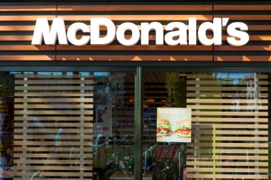 Amsterdam, The Netherlands - August 23, 2016: McDonald's sign, McDonald's is the world's largest chain of hamburger fast food restaurants, serving around 68 million customers daily in 119 countries