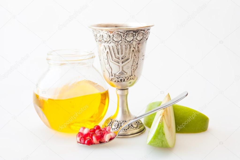 Rosh Hashanah Kiddush cup honey pomegranate and sliced apple