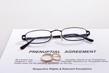 Prenuptial Agreement with wedding rings clipart