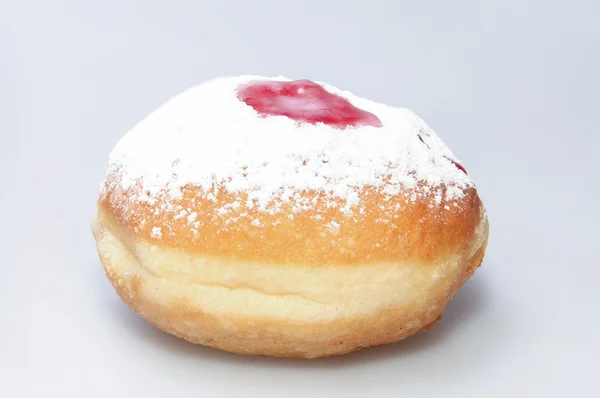 Hanukkah doughnut and spinning top - Traditional jewish holiday food and toy. — Stock Photo, Image