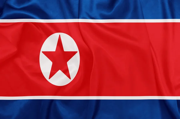 Korea Północna - macha flagi narodowej na jedwabiu tekstura — Zdjęcie stockowe