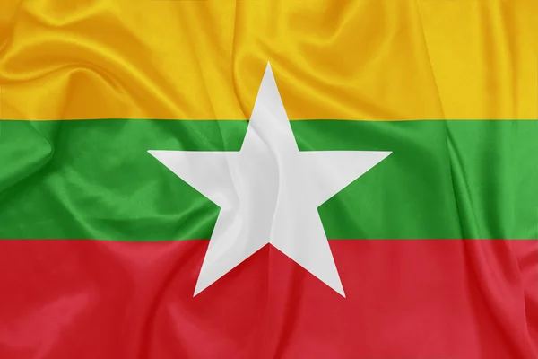 Myanmar - ondeando bandera nacional sobre textura de seda — Foto de Stock