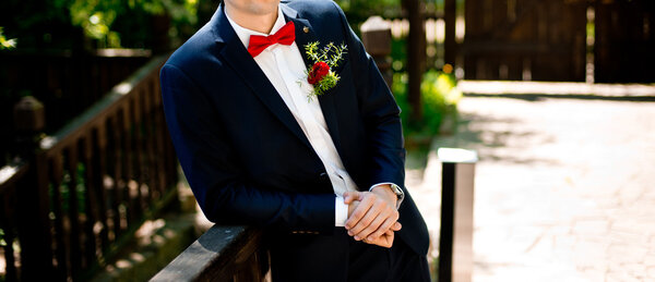 manly groom on photography