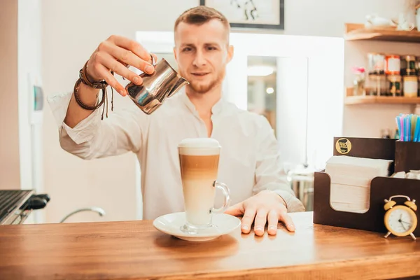 guy learns to make coffee. barista training