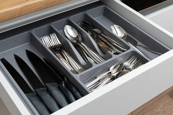 empty kitchen table with chairs and utensils