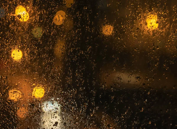 Raindrops Night Window Red Orange Bokeh Lights Streetlights Car Headlights — Stock Photo, Image