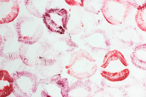 A lip print left by lipstick on white paper. Kiss lipstick patterns and textures