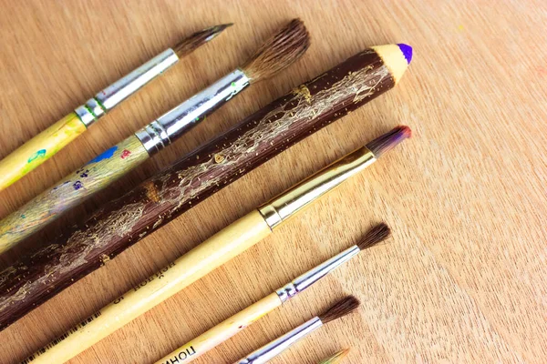 Set Painting Brushes Wooden Pencil Purple Rod Wooden Surface Viewed — Stock Photo, Image