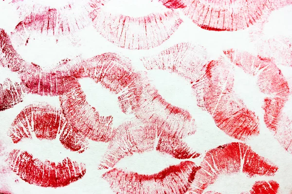 A lot of red kisses isolated on white background. Female lip prints on paper. Lipstick kisses. Print of lips. Beautiful lips stamps. Valentine\'s day, romantic mood and love concept. Kiss and love you.