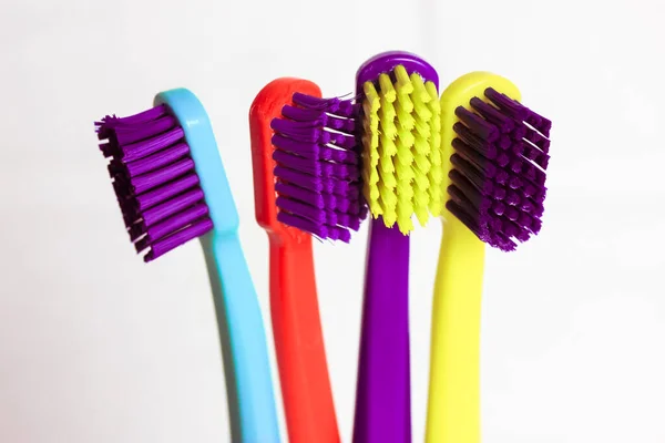 Set Plastic Multicolored Toothbrushes Green Blue Red Purple Transparent Glass — Stock Photo, Image