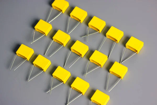 Yellow Film Capacitors Isolated Gray Background Top View Many Square — Stock Photo, Image