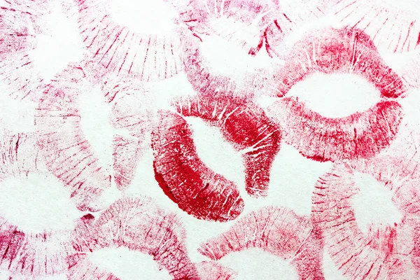 Red kisses isolated on white background. Female lip prints. Lots lipstick kisses