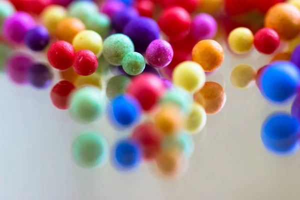 Foam Polystyrene Bright Colorful Beads Reflected Surface Glass Mirror Multicolored — Stock Photo, Image