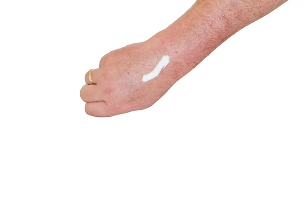 Man's arm with a white cream — Stock Photo, Image