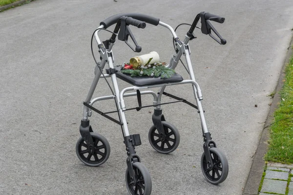 Rollator walker with grave candle — Stock Photo, Image