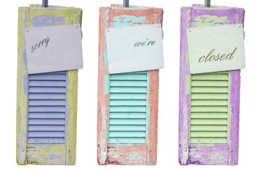 Three old decorative weathered wooden shutters with inscription  clipart