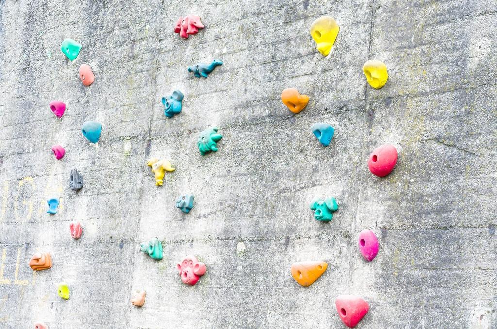 Climbing wall with climbing aids