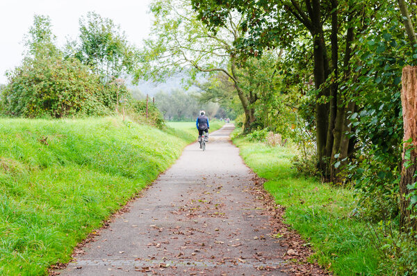 Group of Bicycling at the river Ruhr in Essen Werden