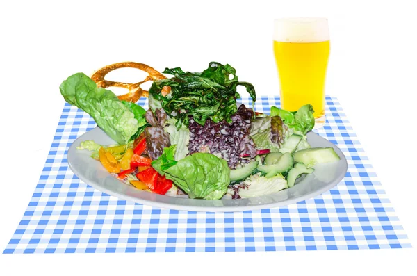 Salad with beer glass and pretzel — Stock Photo, Image